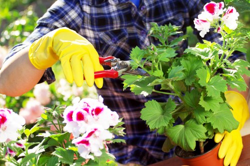 Volunteers sorting garden waste at a community recycling point
