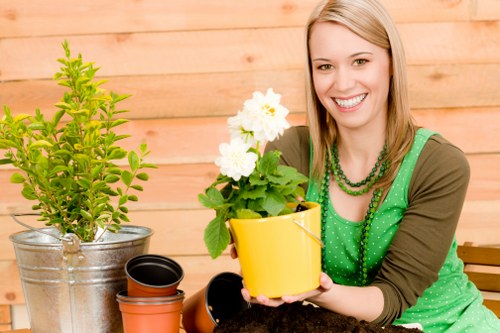 Team member reviewing a garden complaint with notes and photos